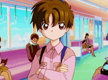 Syaoran with his arms crossed in class, blushing